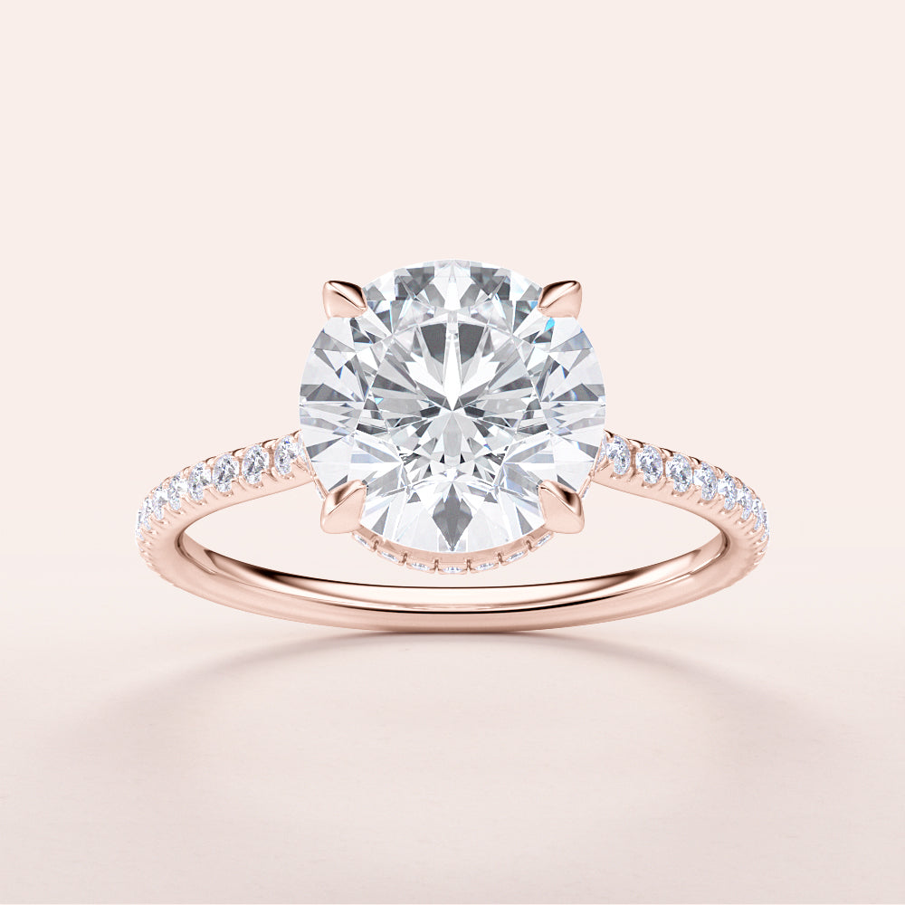 Elegant 14K Rose Gold Engagement Ring featuring a Round Brilliant-Cut Diamond and Pave-Set Diamonds on Band.|







#14KRecycledRoseGold
#18KRecycledRoseGold


