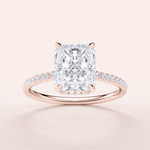 Radiant cut diamond engagement ring withPave band in 14K or 18K rose gold or platinum, not worn on a model.