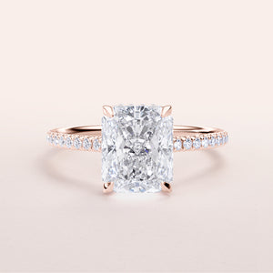 Radiant cut diamond engagement ring in 14K rose gold with delicate diamondPave band for a stunning look.