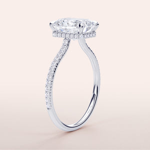 "Luxurious 14K or 18K white gold engagement ring with marquise-cut diamond and pave-set band, showcasing timeless elegance."
