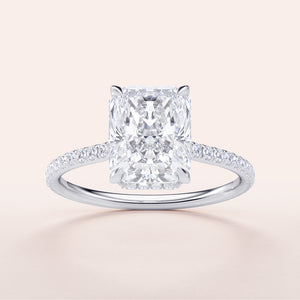 Radiant cut diamond engagement ring with a diamond-encrusted band in 14K white gold. Elegant timeless design, stunning brilliance.