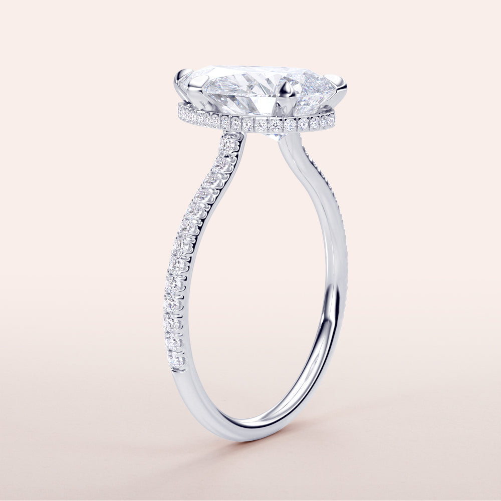 Elegant 14K white gold pear-shaped engagement ring withPave accents, showcasing a stunning diamond in an invisible gallery setting.|

#14KRecycledWhiteGold
#18KRecycledWhiteGold








#Platinum
