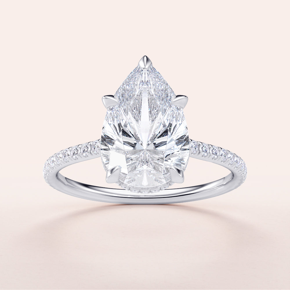 Elegant pear-shaped diamond engagement ring in 14K or 18K gold or platinum, featuring a hidden halo and pave band design.|

#14KRecycledWhiteGold
#18KRecycledWhiteGold








#Platinum