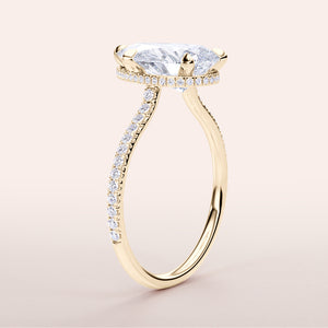 Elegant yellow gold engagement ring featuring a marquise diamond with aPave band, available in 14K, 18K, or platinum.