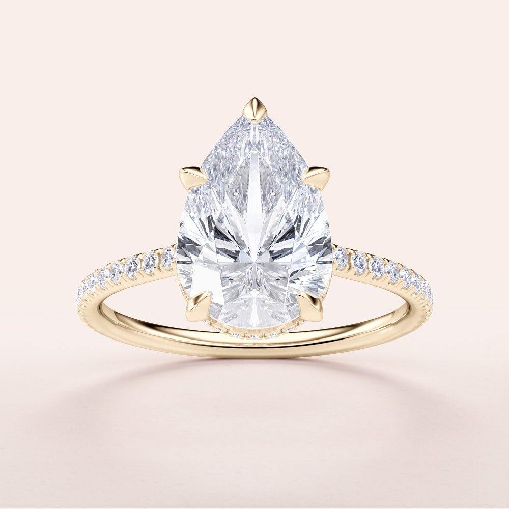 Elegant pear-shaped diamond engagement ring in 14K or 18K gold or platinum with pave band and hidden halo design.|




#14KRecycledYellowGold
#18KRecycledYellowGold






