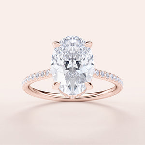Elegant 14K Rose Gold oval diamond engagement ring with a halo pave band and sparkling center stone, perfect for any occasion.