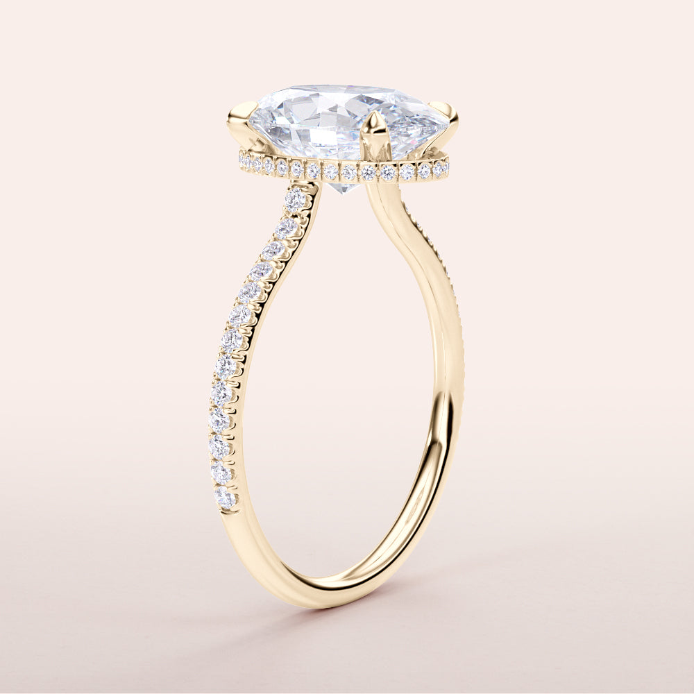 Elegant yellow gold engagement ring featuring an oval diamond and a diamond-encrusted band, available in 14K, 18K, or platinum.