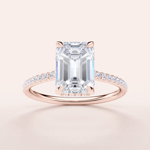 Emerald-cut diamond engagement ring with pave band, crafted in 14K or 18K rose gold and platinum. Elegant and stunning design.