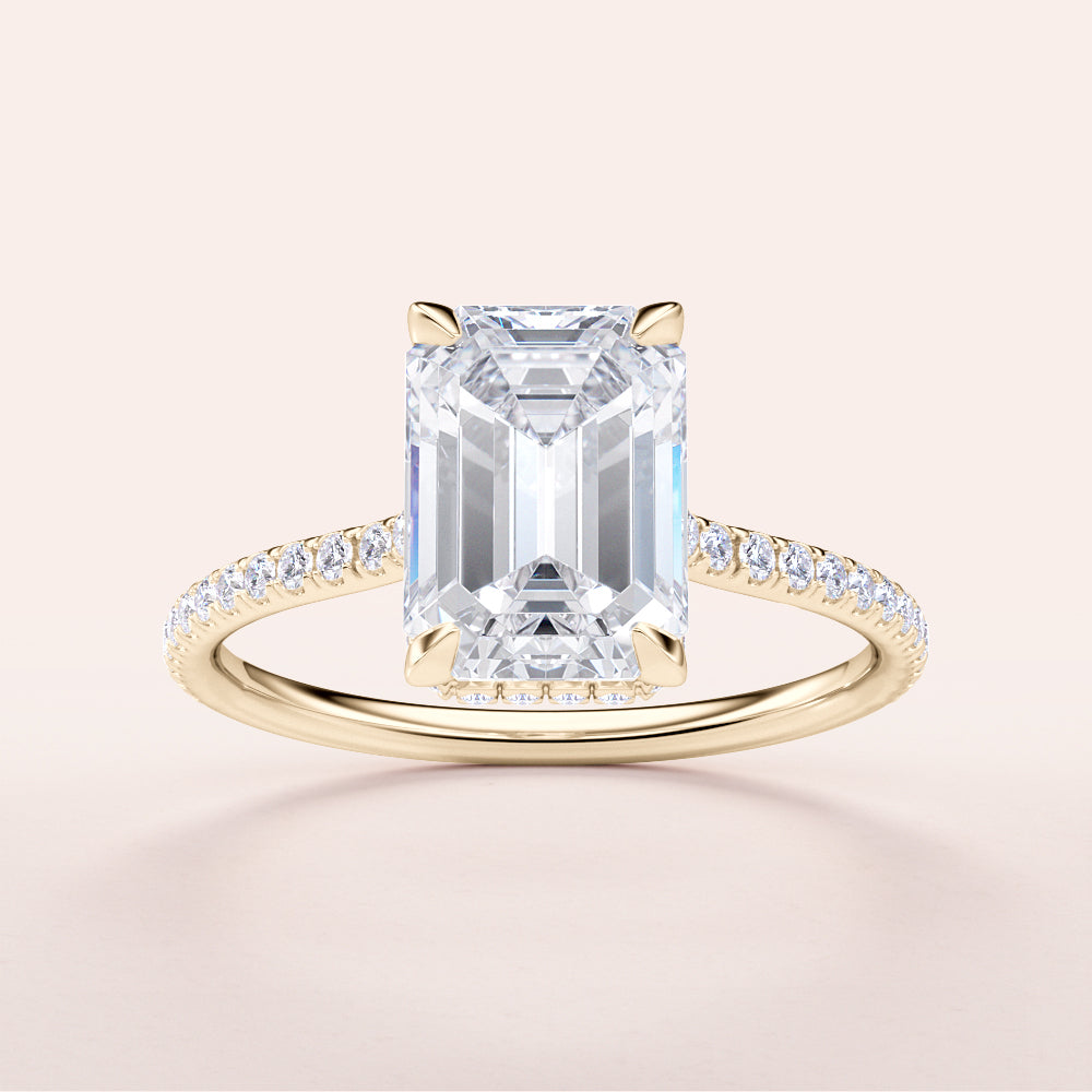 Elegant emerald-cut diamond engagement ring with petite accent diamonds in 14K yellow gold, featuring a unique invisible gallery and hidden halo.|




#14KRecycledYellowGold
#18KRecycledYellowGold






