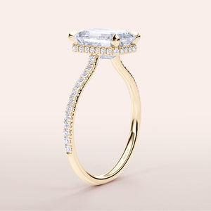 Elegant 14K gold engagement ring with emerald, invisible gallery, and pave bandâ€”perfect for timeless luxury.