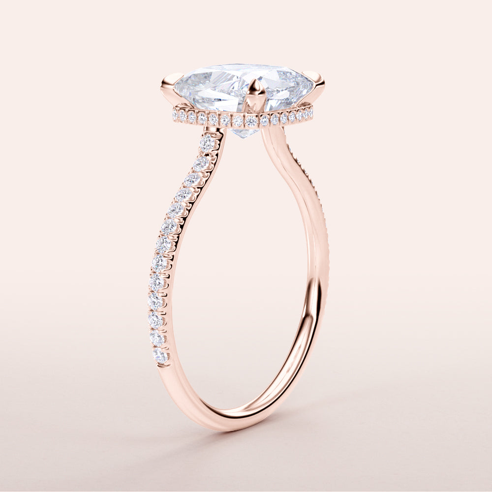 Side view of a 14K rose gold engagement ring with cushion-cut diamond and halo, featuring a pave-set band for added sparkle.|







#14KRecycledRoseGold
#18KRecycledRoseGold


