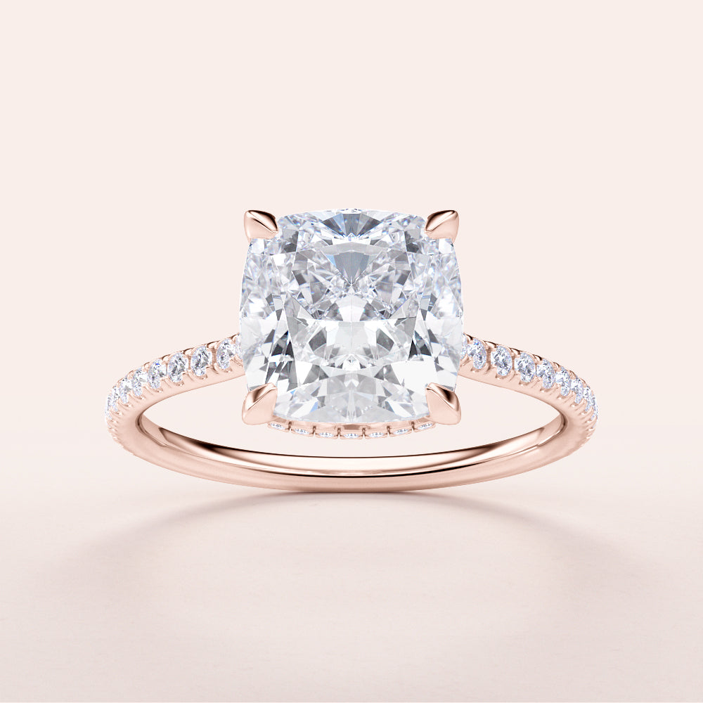 Elegant 14K rose gold engagement ring featuring a cushion-cut diamond and dazzling pave band, perfect for timeless love.|







#14KRecycledRoseGold
#18KRecycledRoseGold


