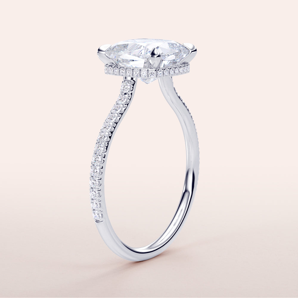 Close-up of a stunning 14K/18K white gold engagement ring with a brilliant marquise-cut diamond and intricatePave-set accents.|

#14KRecycledWhiteGold
#18KRecycledWhiteGold








#Platinum