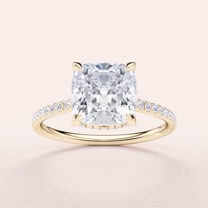Elegant 14K or 18K gold cushion-cut diamond engagement ring with a hidden halo and shimmering pave band.