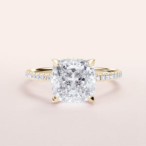 Elegant 14K & 18K gold cushion cut diamond engagement ring with pave band, featuring hidden halo design.