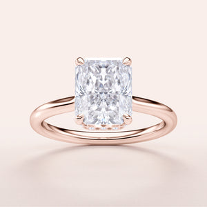 Elegant 14K rose gold engagement ring featuring a stunning radiant-cut diamond in an invisible gallery hidden halo design.