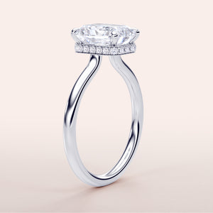 Elegant 14K or 18K white gold engagement ring with radiant cut diamond andPave halo, showcasing intricate details.