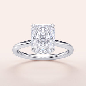 "14K White Gold engagement ring featuring a radiant-cut diamond with an invisible gallery and hidden halo, displayed on a neutral background."