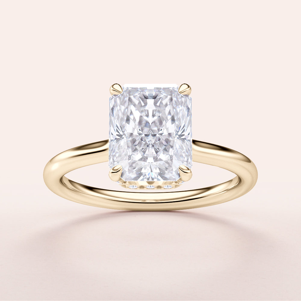 Radiant cut diamond ring in 14K gold, featuring an invisible gallery and hidden halo, perfect for modern elegance.