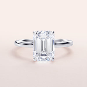 Elegant 14K/18K engagement ring featuring an emerald-cut diamond with an invisible gallery and hidden halo design.