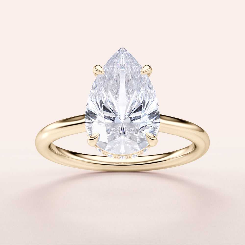 Pear-shaped diamond engagement ring in a sleek 14K gold band, featuring an elegant solitaire design.|




#14KRecycledYellowGold
#18KRecycledYellowGold





