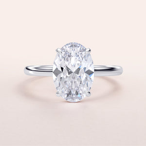 Luxurious 14K/18K gold or platinum engagement ring featuring an exquisite oval-shaped diamond on a neutral background.
