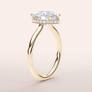 Elegant 14K yellow gold engagement ring with oval diamond, hidden halo, and plain band, perfect for timeless romance.