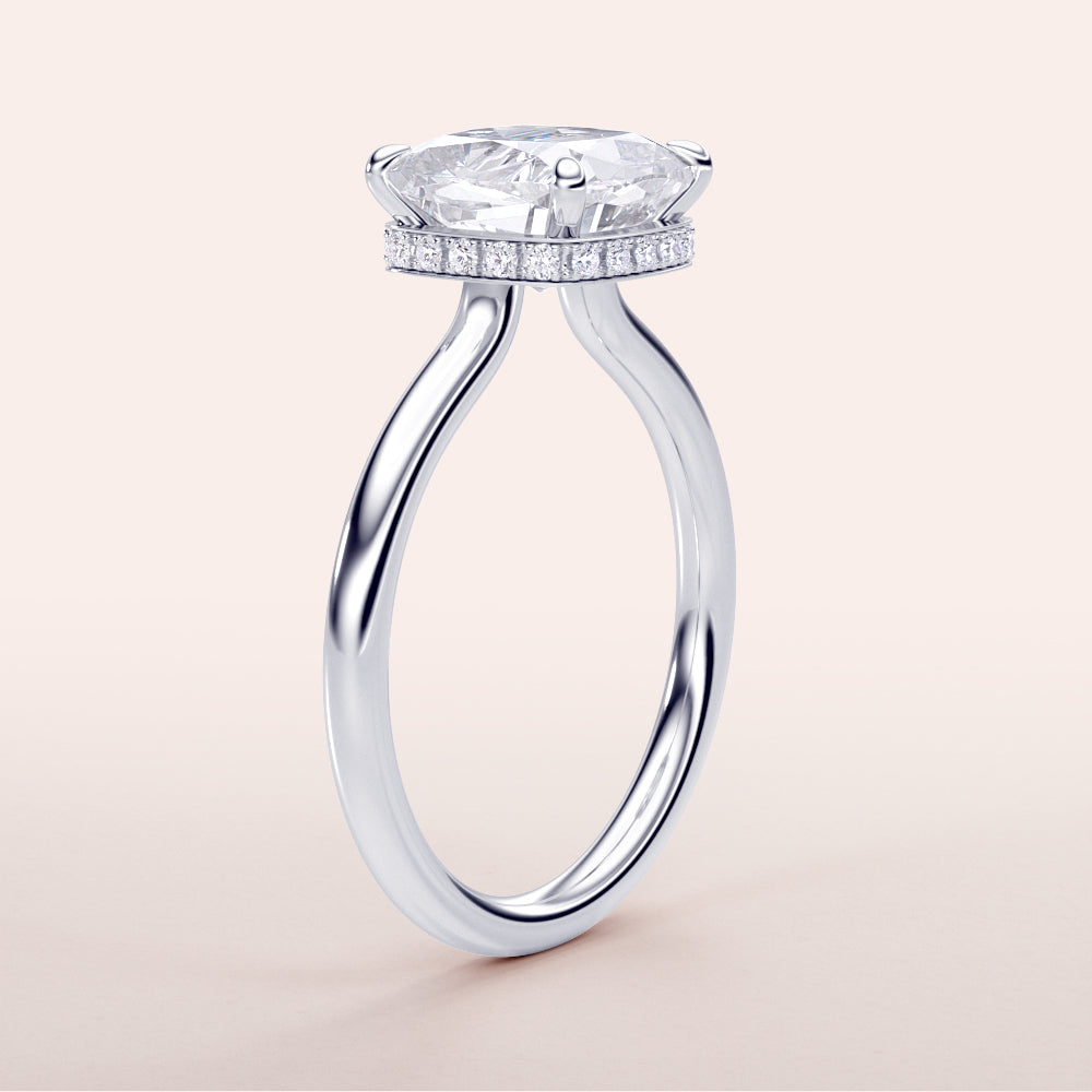 Stunning 14K/18K/platinum engagement ring featuring an oval-cut diamond with hidden halo, perfect for timeless elegance.