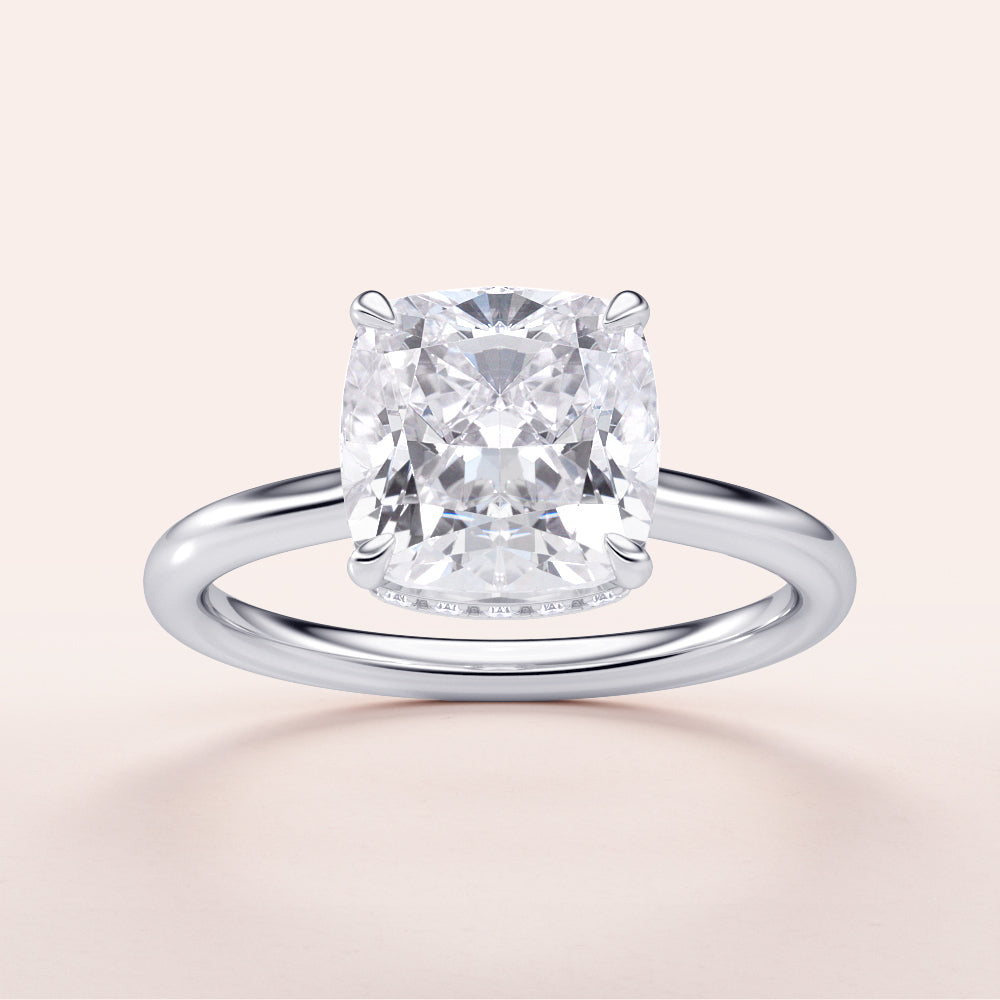 Cushion cut diamond solitaire engagement ring in 14K white gold; available in 18K gold or platinum; exquisite craftsmanship.
