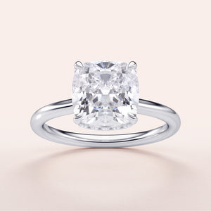 Cushion cut diamond solitaire engagement ring in 14K white gold; available in 18K gold or platinum; exquisite craftsmanship.