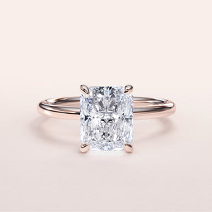 Elegant 14K rose gold engagement ring featuring a radiant-cut diamond in a stunning solitaire design, perfect for special occasions.
