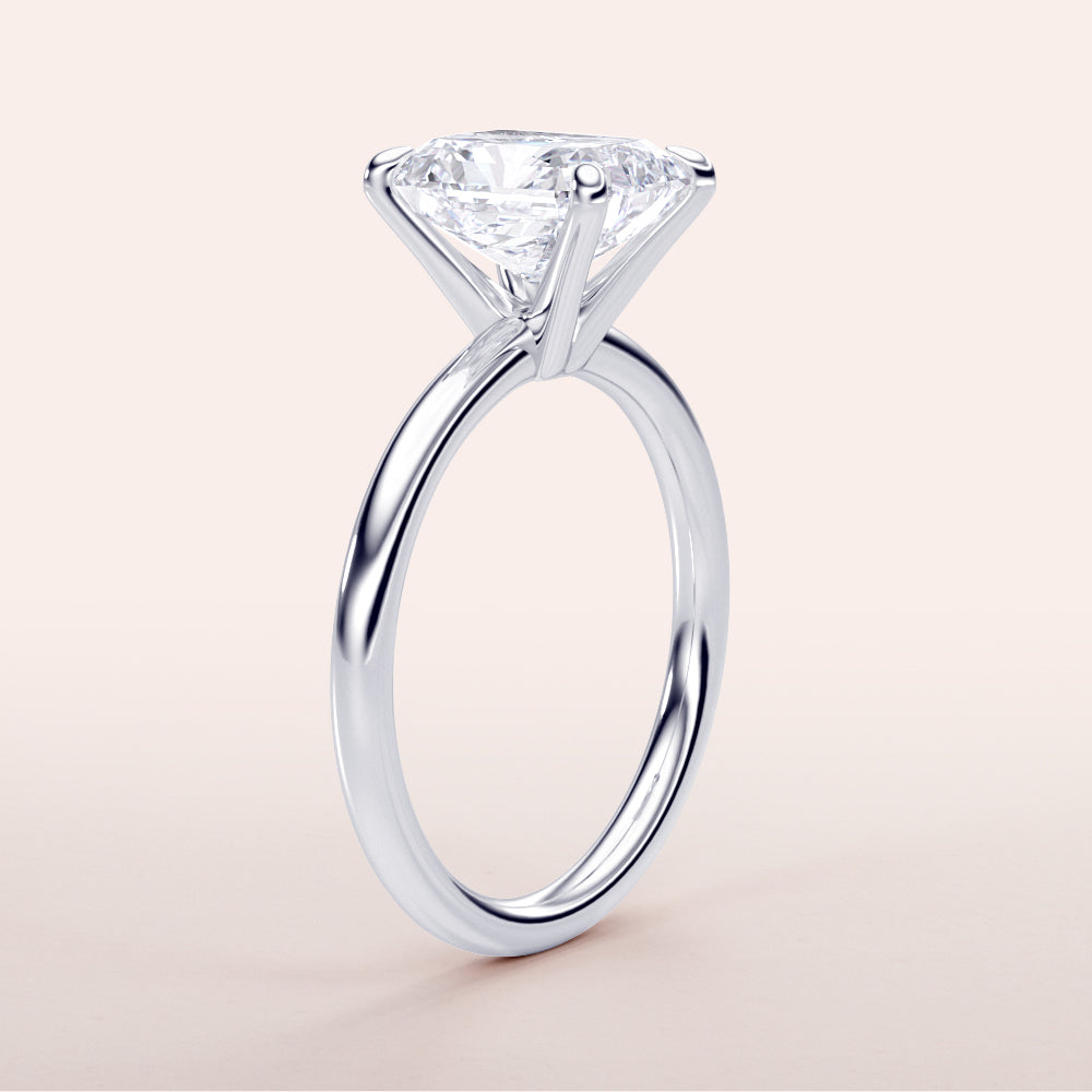 "Radiant classic solitaire engagement ring with a brilliant-cut diamond, available in 14K or 18K white gold."