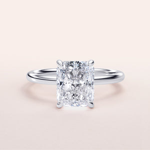 Elegant 14K/18K white gold engagement ring featuring a radiant-cut diamond in a classic solitaire setting.