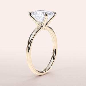 Elegant 14K/18K yellow gold solitaire engagement ring with marquise-cut diamond on a light background.