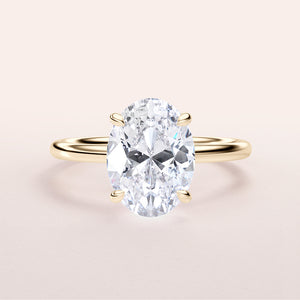 14K yellow gold engagement ring featuring a stunning oval-cut diamond center stone. Elegant and timeless design for proposals.