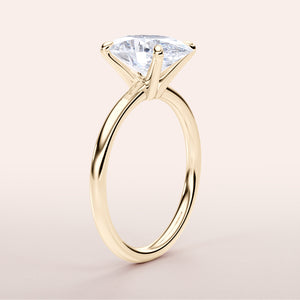 Elegant 14K or 18K gold solitaire engagement ring featuring a radiant cushion-shaped diamond in a classic prong setting.