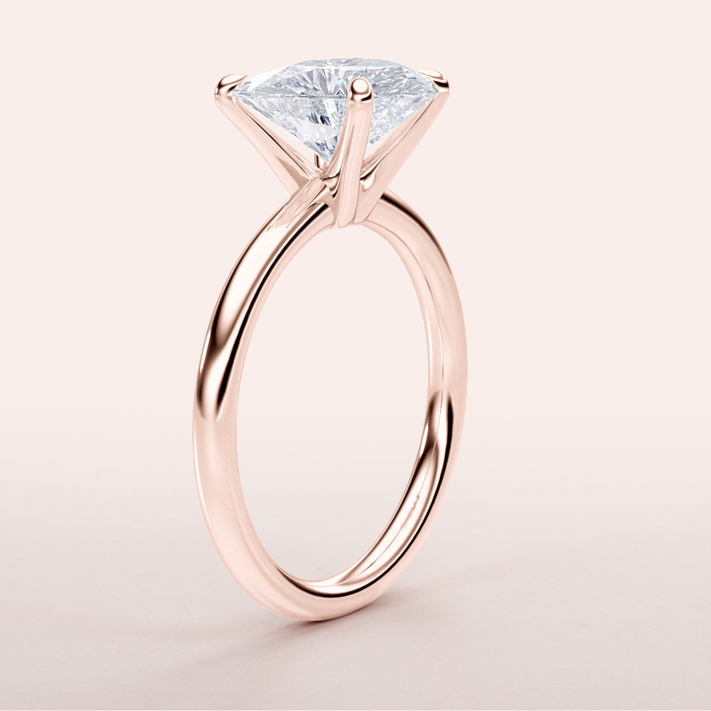 Elegant 14K rose gold solitaire engagement ring featuring a stunning marquise diamond, displayed alone for a timeless look.|







#14KRecycledRoseGold
#18KRecycledRoseGold


