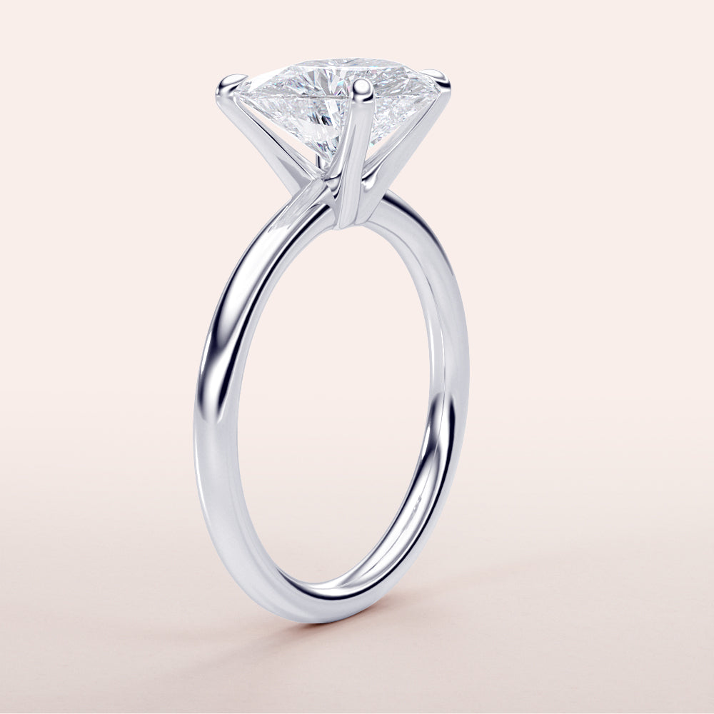 Elegant 14K white gold solitaire engagement ring featuring a pear-shaped diamond, perfect for timeless love and special occasions.|

#14KRecycledWhiteGold
#18KRecycledWhiteGold








#Platinum
