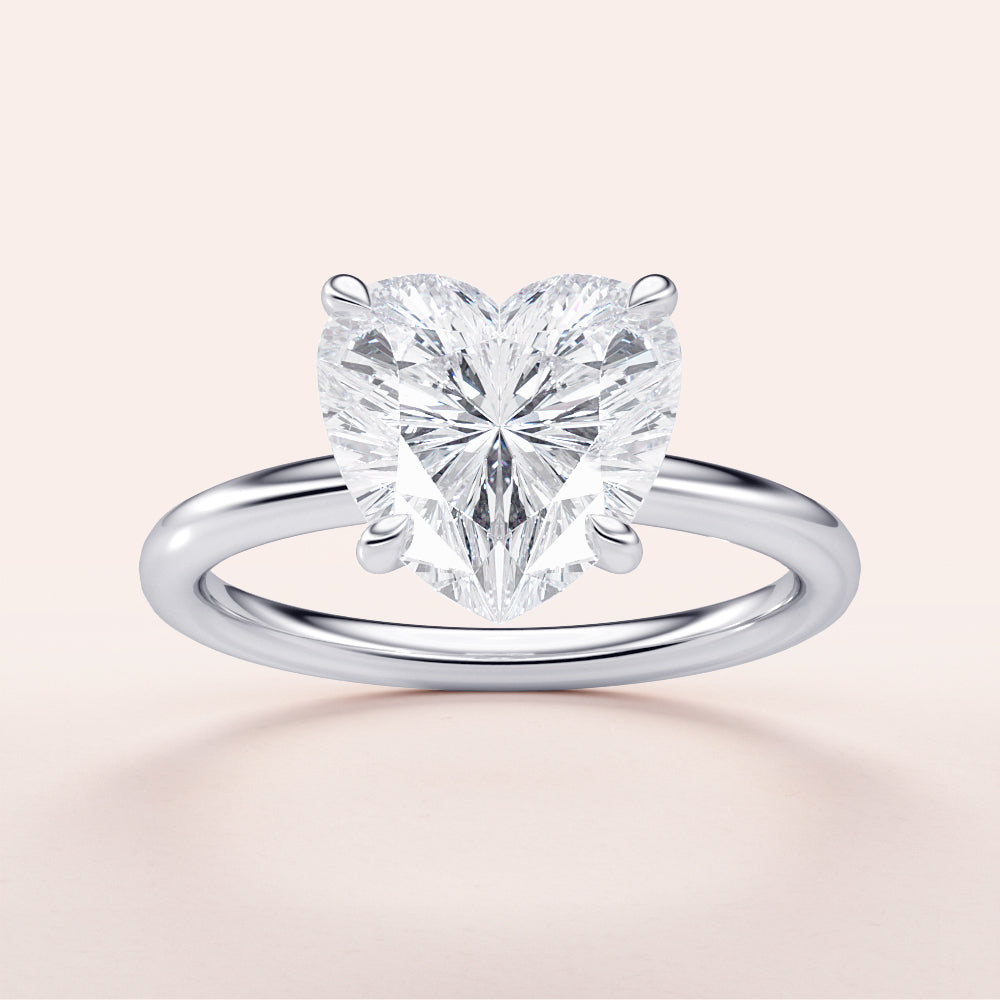 Elegant heart-shaped diamond engagement ring in 14K, 18K, or platinum, displayed on a neutral background.|

#14KRecycledWhiteGold
#18KRecycledWhiteGold








#Platinum