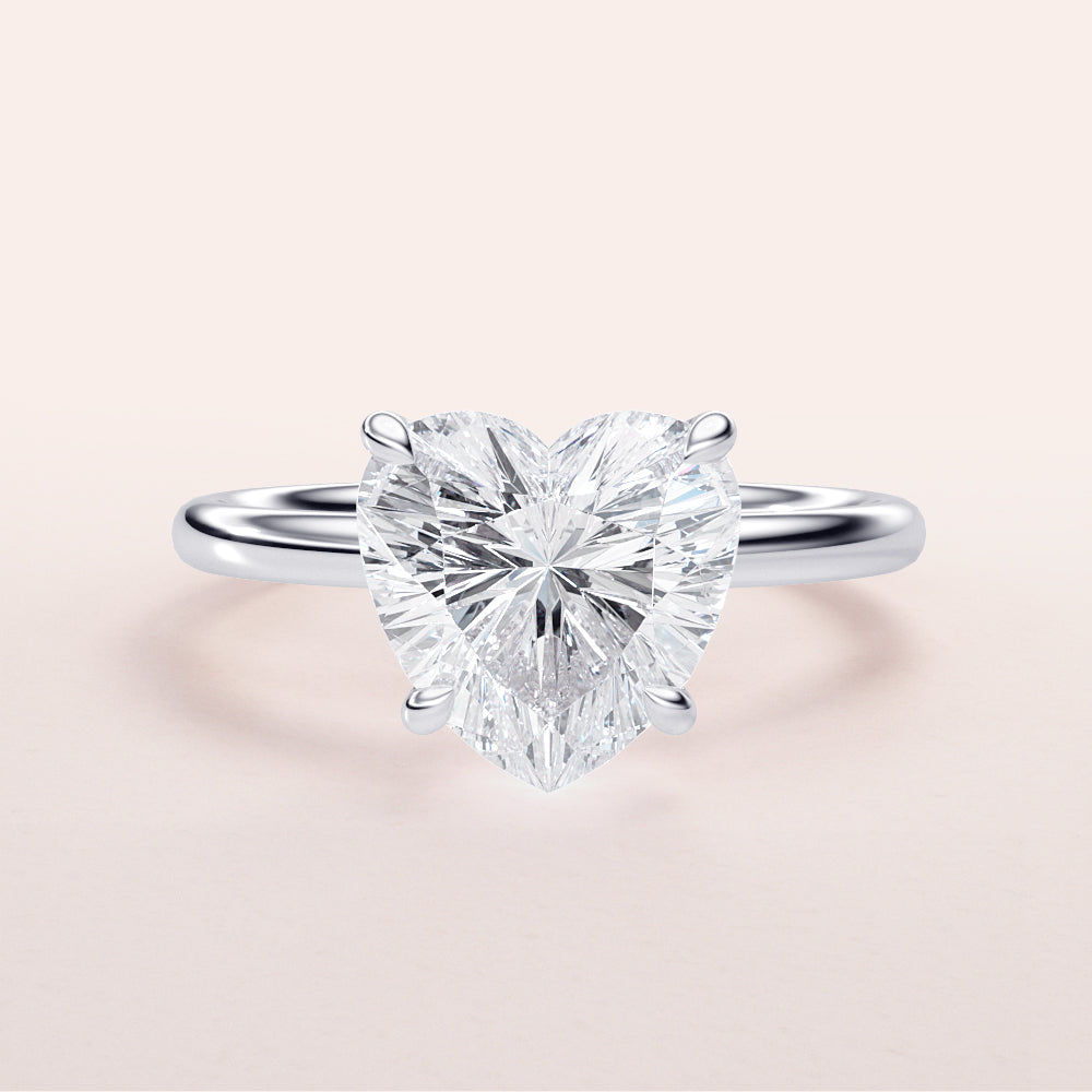 Elegant heart-shaped diamond engagement ring in 14K white gold, featuring a brilliant centerpiece for a romantic proposal.|

#14KRecycledWhiteGold
#18KRecycledWhiteGold








#Platinum