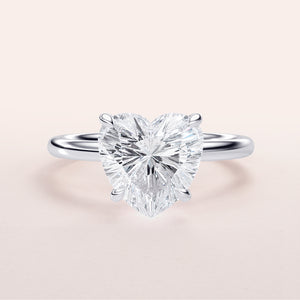 Elegant heart-shaped diamond engagement ring in 14K white gold, featuring a brilliant centerpiece for a romantic proposal.