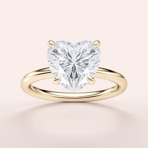 Heart-shaped diamond engagement ring in 14K or 18K yellow gold band, perfect for declaring your everlasting love.