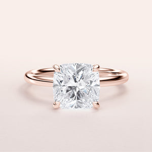 Elegant 14K rose gold engagement ring featuring a cushion cut diamond center stone for timeless beauty and sophistication.