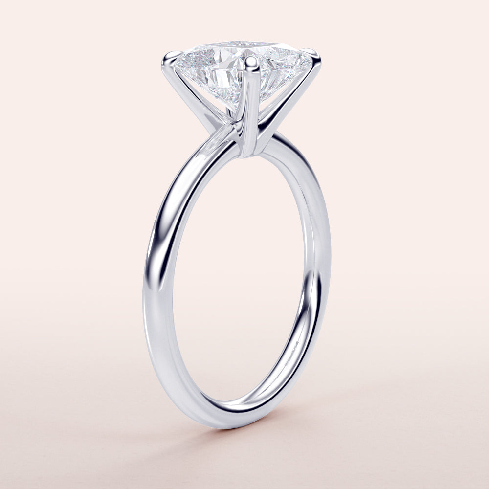 Elegant white gold solitaire engagement ring featuring a marquise-cut diamond, available in 14K, 18K, or platinum.|

#14KRecycledWhiteGold
#18KRecycledWhiteGold








#Platinum