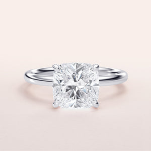 Elegant cushion-cut diamond engagement ring in 14K or 18K white gold or platinum setting. Perfect for timeless romance.