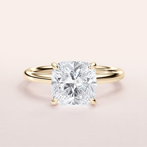 Radiant cut diamond engagement ring in 14K yellow gold, displayed on a light background, highlighting its classic solitaire style.