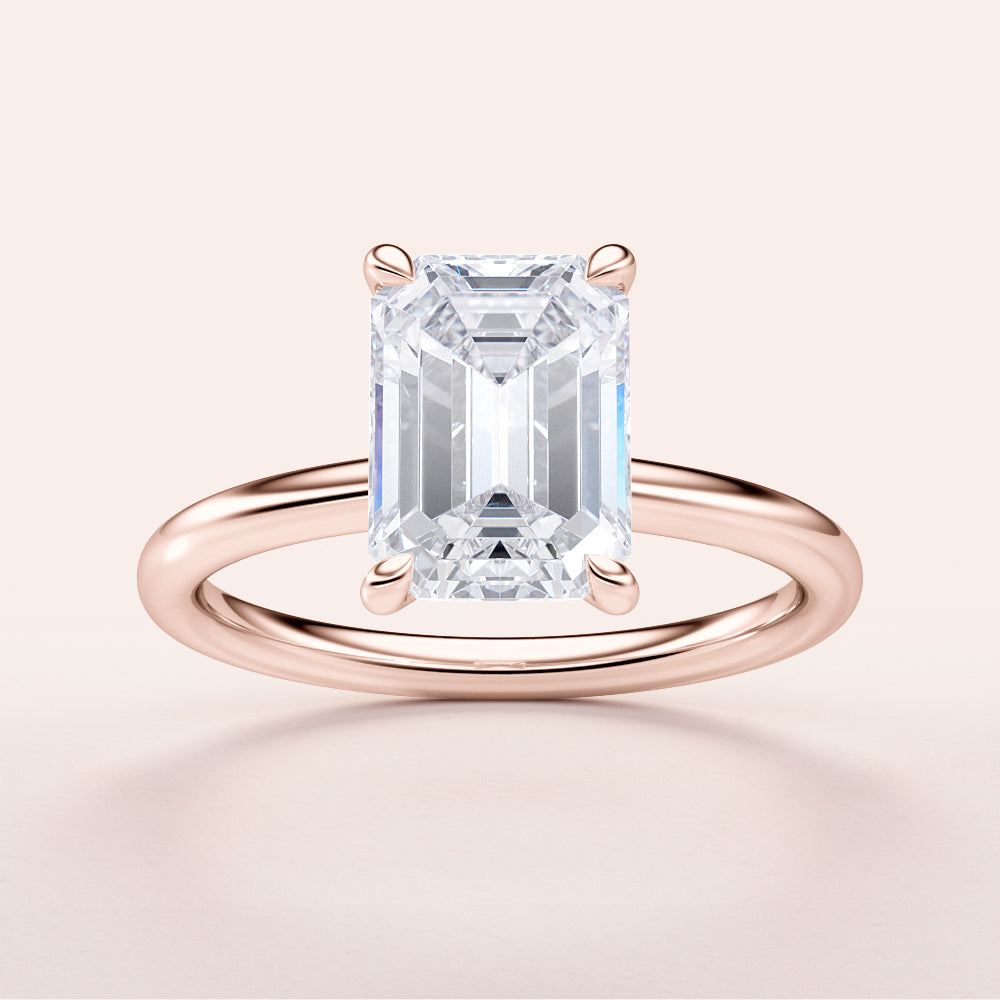 Emerald-cut diamond engagement ring in 14K rose gold, featuring a polished band for a timeless, elegant design.|







#14KRecycledRoseGold
#18KRecycledRoseGold


