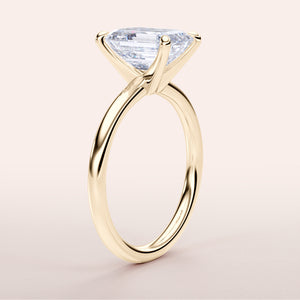 Elegant 14K yellow gold solitaire engagement ring with marquise-cut diamond, perfect for timeless romance.