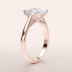 Elegant 14K rose gold engagement ring featuring a brilliant cushion diamond in a classic solitaire cathedral setting.