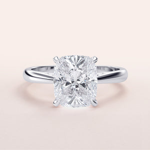 "Luxurious 14K or 18K white gold engagement ring featuring a stunning cushion cut diamond, elegantly displayed."